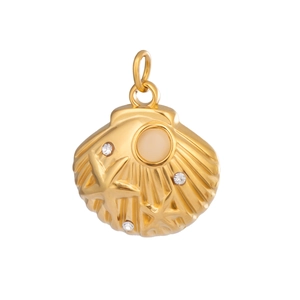 Close-up of a textured 18K gold shell pendant set with clear and round gemstones