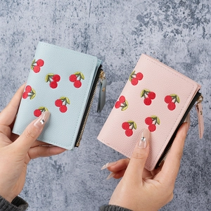 Short faux leather cherry embroidery wallets in light blue and pink with zipper detail