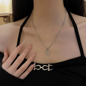 Minimalist silver box chain necklace with a small round coin pendant for women