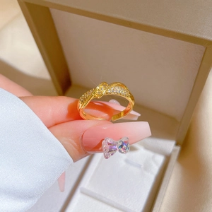 Elegant gold twisted ring with sparkling crystals and adjustable open band for women