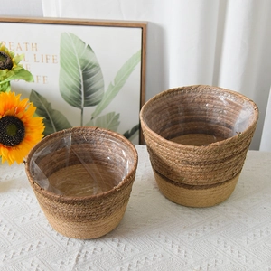 Detail of natural seagrass woven baskets with waterproof liners on a lace tablecloth