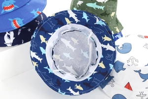 Detail of baby sun hats featuring breathable mesh lining and adjustable chin straps