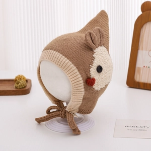 Detailed view of cute khaki knitted baby rabbit hat with pointed top and earflaps