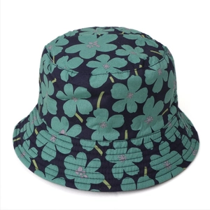 Detail of navy cotton sun hat with green floral pattern and reinforced brim stitching