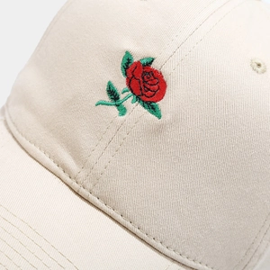 Beige cotton baseball cap featuring detailed red rose embroidery for a summer look