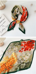 Detail of floral pleated scarf with vibrant orange and green prints and sawtooth edges