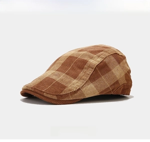 Detail of vintage brown plaid beret hat with soft knitted fabric and side profile