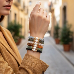 Set of six stretch bracelets featuring irregular colored stones, pearls and gold beads