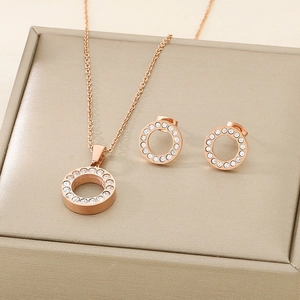 Set gioielli in oro rosa con collana rotonda in cristallo e orecchini a lobo