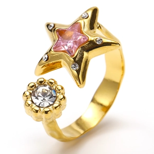 Detail of gold-plated star ring with pink zircon heart and sparkling white crystal accent