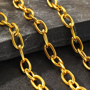 Macro view of 18K gold plated stainless steel twisted chain on textured stone surface