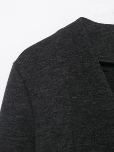Detail view of charcoal grey soft knit jacket showing shoulder seam and fabric texture