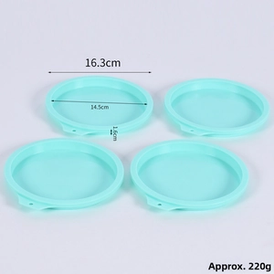 Detail of mint green 4-inch silicone cake molds with dimensions and dimensions markers