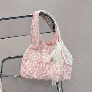 Detailed view of pink lace tote bag with 3D floral embroidery and white lace bow knots