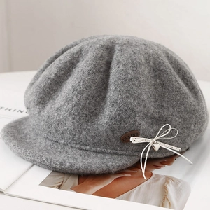 Gray wool octagonal baker boy hat with polka dot bow and silver heart pendant detail
