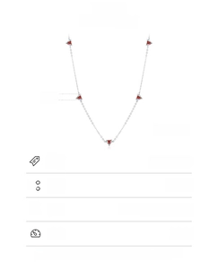 Macro detail of 925 sterling silver necklace with five red heart-shaped zircon pendants