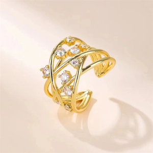 Crossed gold ring featuring micro-paved zircons and minimalist open adjustable design