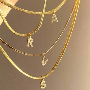 Flat snake bone chain necklace with sparkling zircon inlaid initial letter pendant