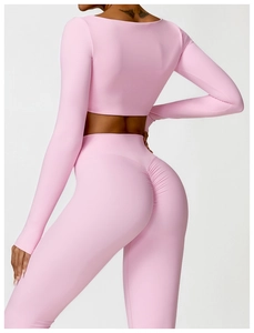Close-up of the light pink yoga set featuring scrunch butt leggings and long sleeve top