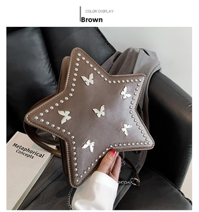 Detail of star-shaped brown leather bag with butterfly 3D accents and silver studs