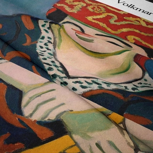 Macro shot of artistic bohemian tapestry showing vibrant texture and printed details