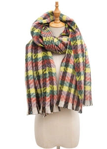 Detail view of colorful plaid knit scarf with soft fringe trim for autumn and winter seasons