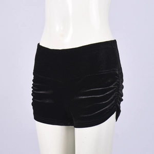 Detail view of black velvet high-waisted shorts featuring side drawstring ruching details
