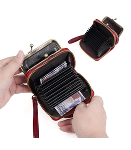Internal view of red leather accordion wallet showing multi-card slots and coin pocket