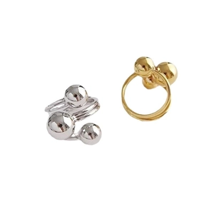 Exaggerated irregular planet rings in gold and silver finish for a modern statement