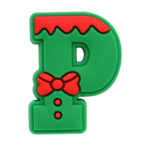 Close-up of PVC letter P charm with red bow and dots for clog shoes decoration