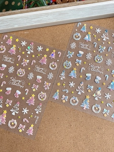 Holographic Christmas nail stickers featuring snowflakes and Christmas trees on wood background