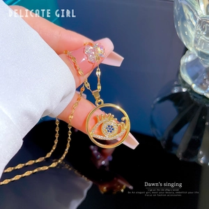 Gold titanium steel necklace featuring a blue evil eye pendant with clear crystals