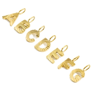 Detail of 14K gold plated stainless steel letter pendants A to G with twill pattern