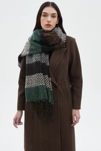 Detail shot of multi-colored striped scarf with tassels and large blended fabric weave