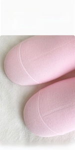 Detailed close-up of smooth hand-sewn seamless toe design on pink cotton socks