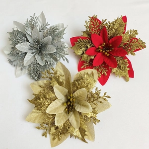 Close-up of glittery poinsettia flowers in silver, red, and champagne gold for Christmas