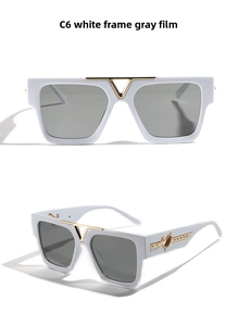 Detail of white square frame sunglasses with gold V-bridge and heart arrow temple