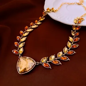 Golden wheat leaf necklace with amber marquise crystals and large triangle pendant