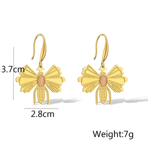 Detailed view of gold butterfly earrings with pink gemstones and dimension measurements