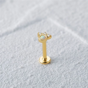 Detailed macro view of S925 silver gold earring with opal stone and three tiny zircons