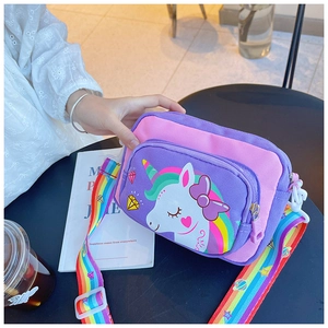 Detail of pink and purple unicorn crossbody bag with adjustable rainbow shoulder strap