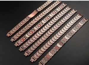 Macro shot of rose gold magnetic titanium bracelets with multiple linked designs