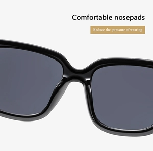 Detail of integrated thickened nose pads on black square sunglasses for comfort