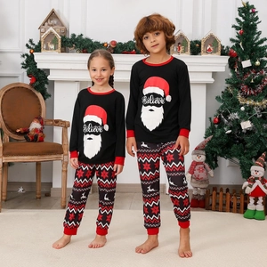 Kids Christmas pajama set with Santa 'Believe' print top and geometric patterned pants