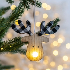 Lighted wooden reindeer ornament with plaid antlers hanging on a Christmas tree