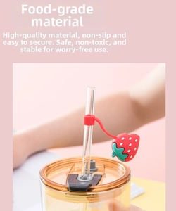Detail of strawberry silicone straw cover with food-grade material and anti-slip loop