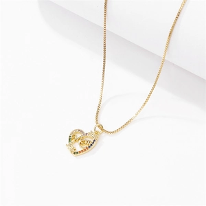 Gold heart MOM pendant necklace with rainbow cubic zirconia on a white background