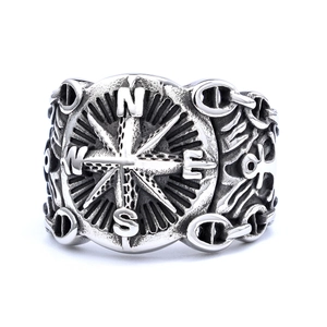 Vintage stainless steel nautical compass ring with oxidized silver finish and NESW engraving