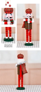 Close-up of 36cm golf nutcracker figure with red plaid hat and golf club detail