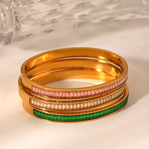 Detail of three-piece 18K gold stainless steel bracelets with multicolored zircon stones